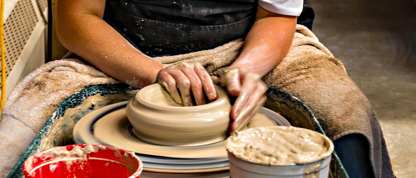 Spinning a bowl on the pottery wheel