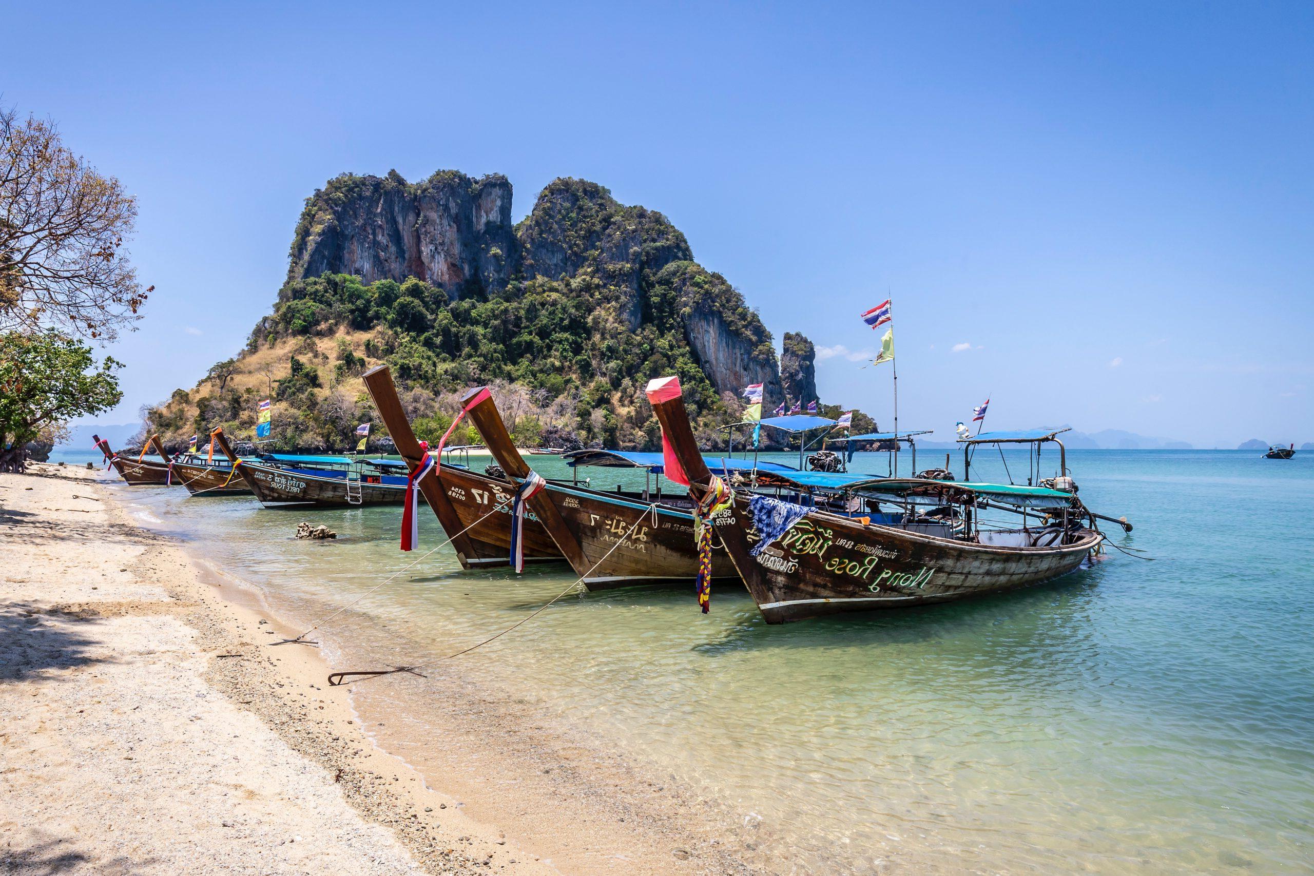 Photo of boats docked at an island