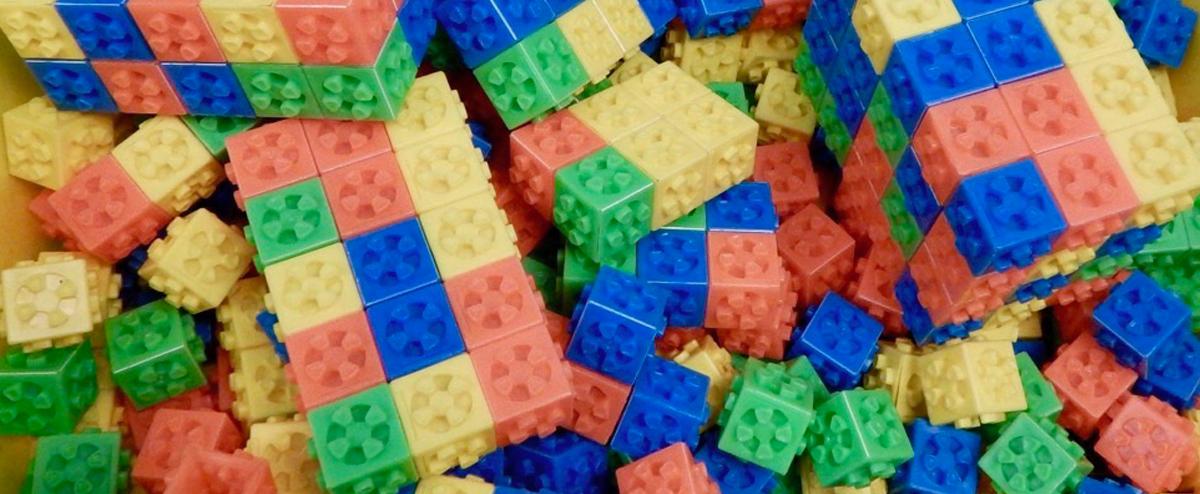 Image of a pile of colorful children's lego-style bricks.